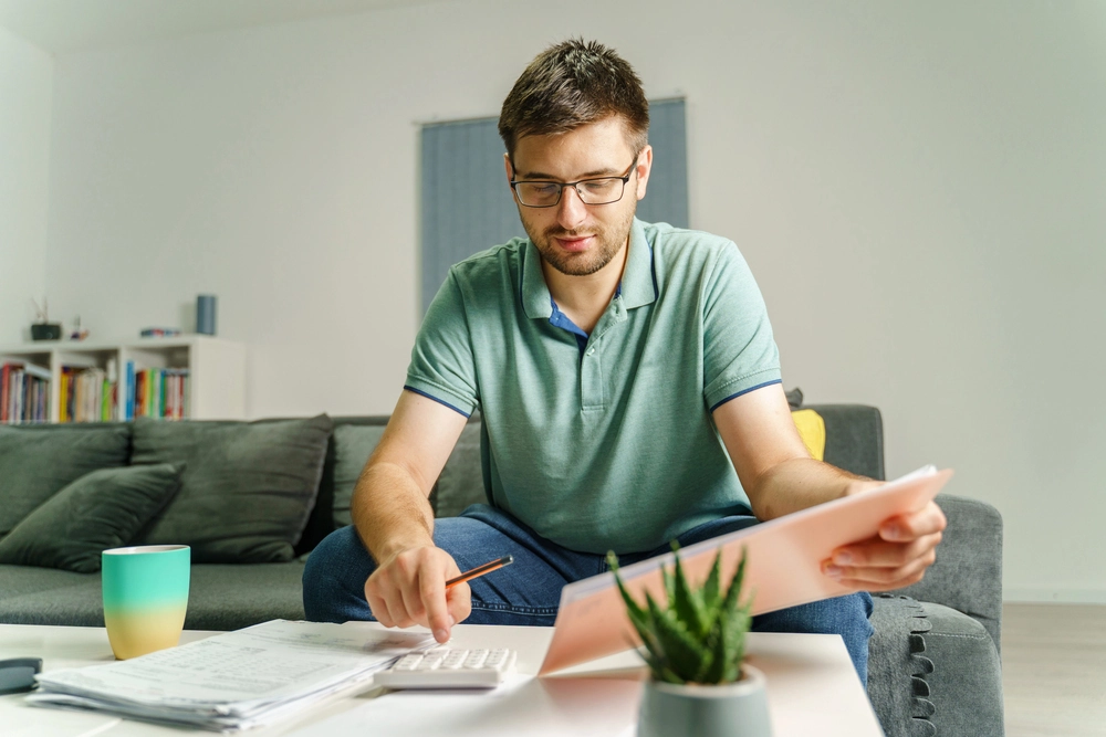 Ecommerce seller calculating how much it costs to start an online store